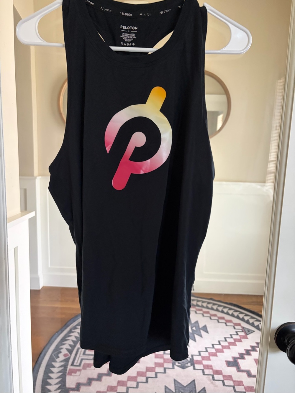 Peloton Women's Black Tank Top with Pink-Yellow Gradient Logo